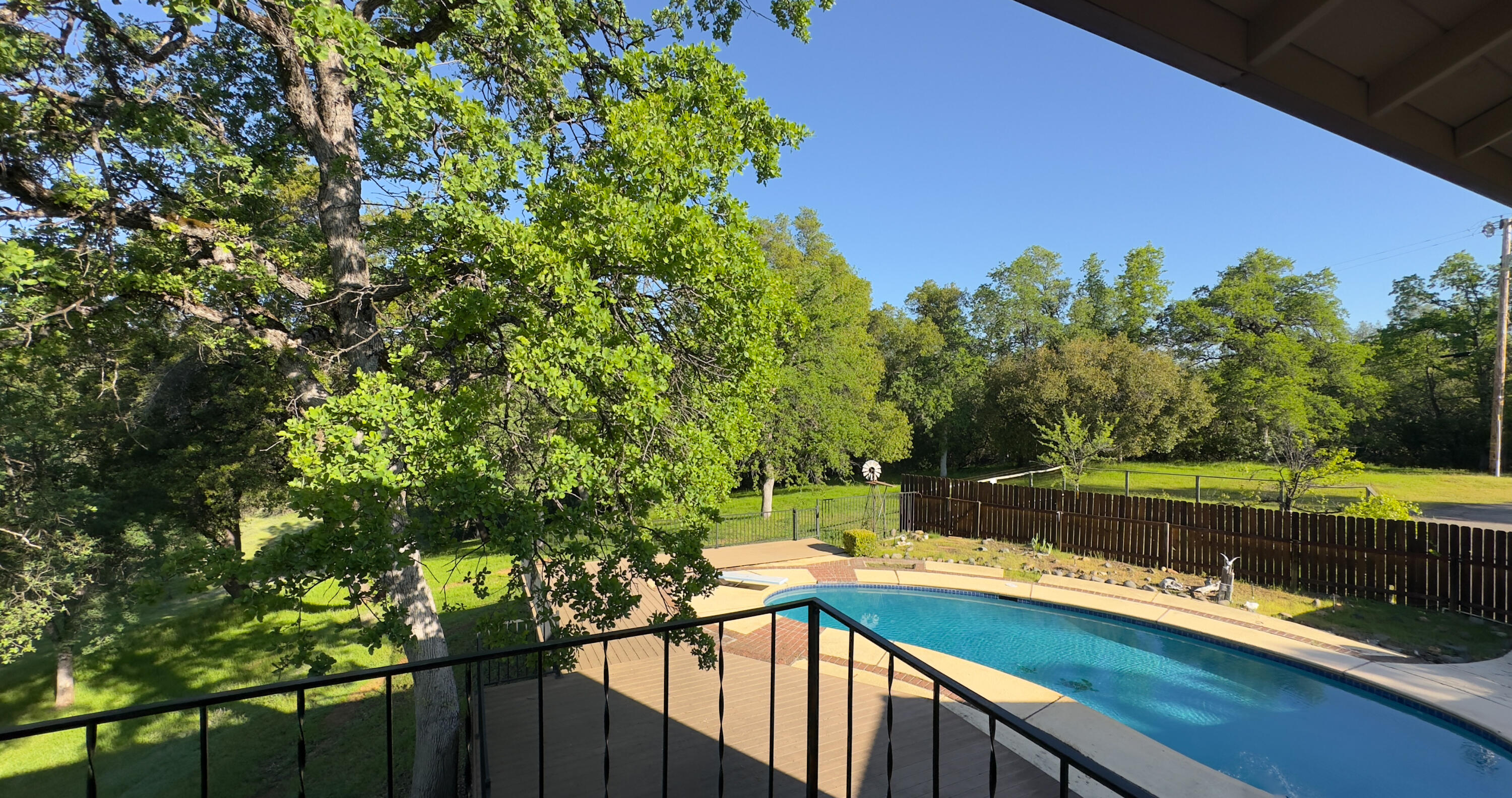 16588 Stanislaus Drive Redding, CA 96001 - Photo 36 of 53 a view of a lake with a house in the background