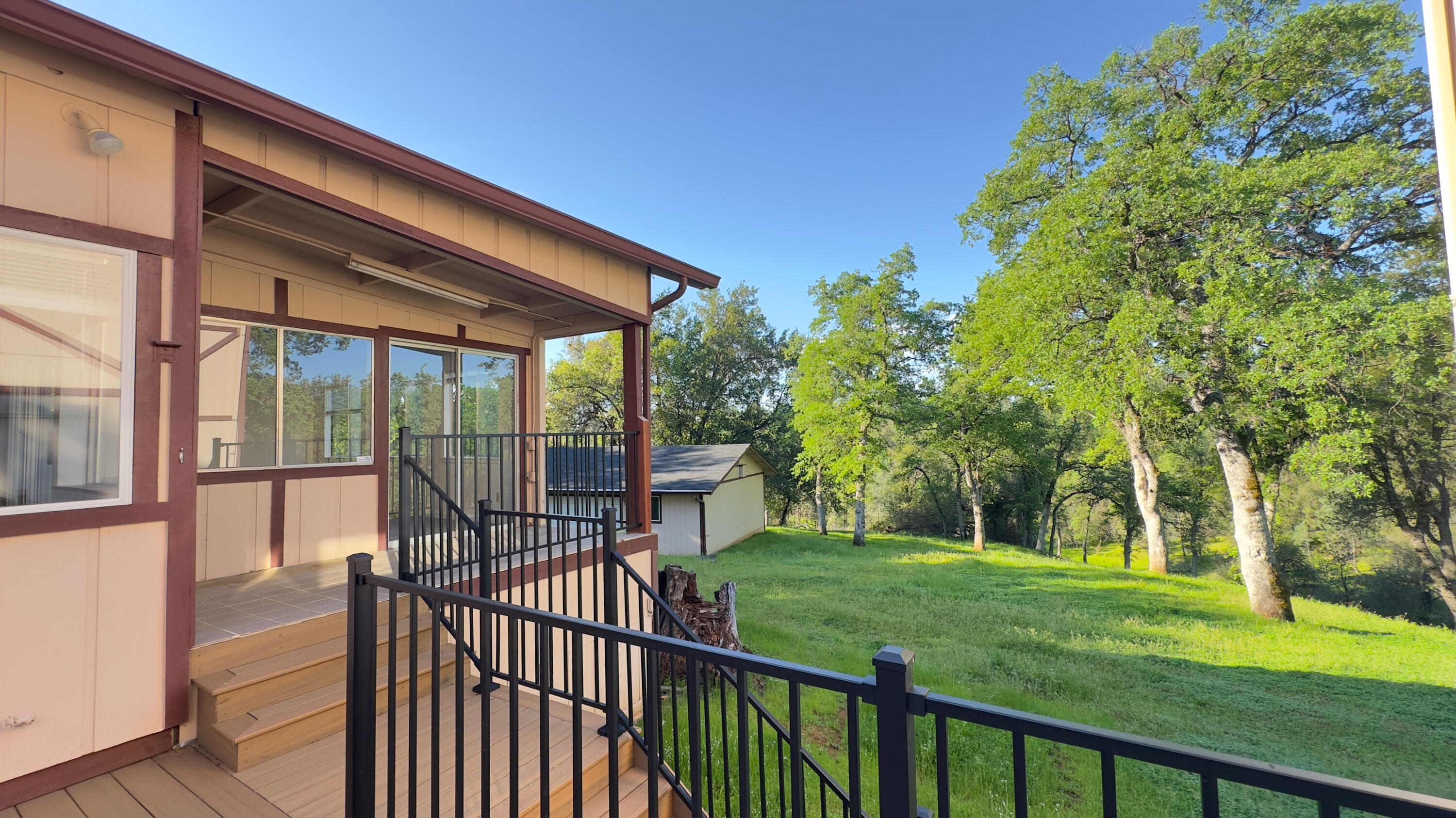16588 Stanislaus Drive Redding, CA 96001 - Photo 38 of 53 a view of a porch with a backyard