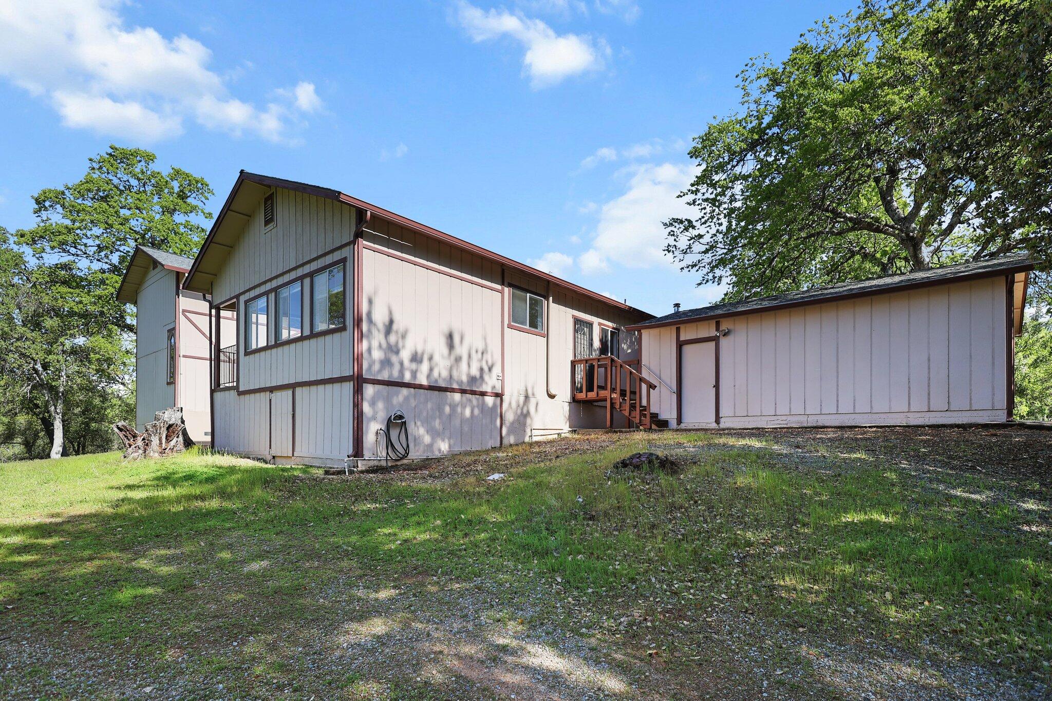 16588 Stanislaus Drive Redding, CA 96001 - Photo 41 of 53 a house view with a garden space