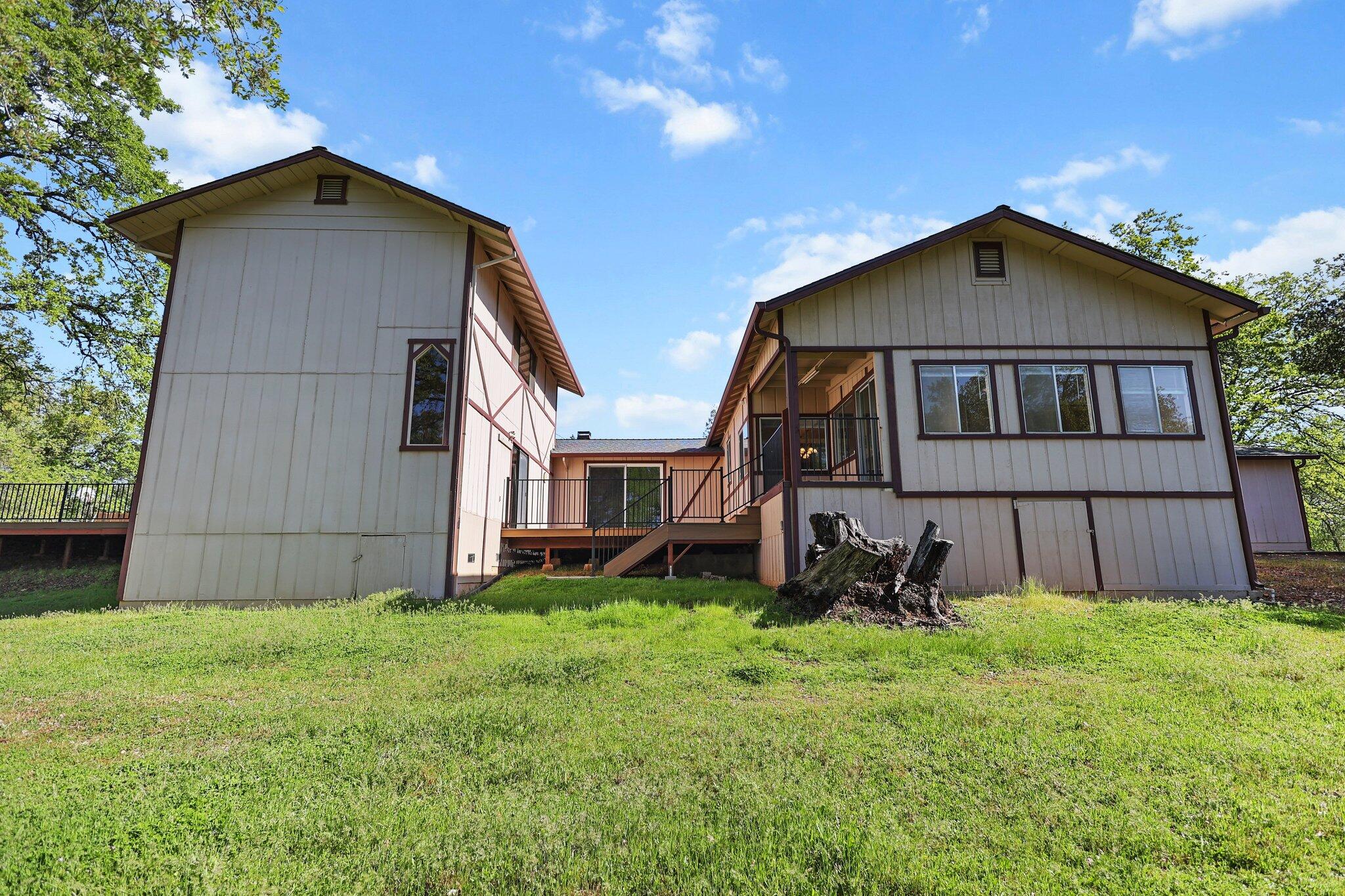 16588 Stanislaus Drive Redding, CA 96001 - Photo 42 of 53 a house with green field in front of it