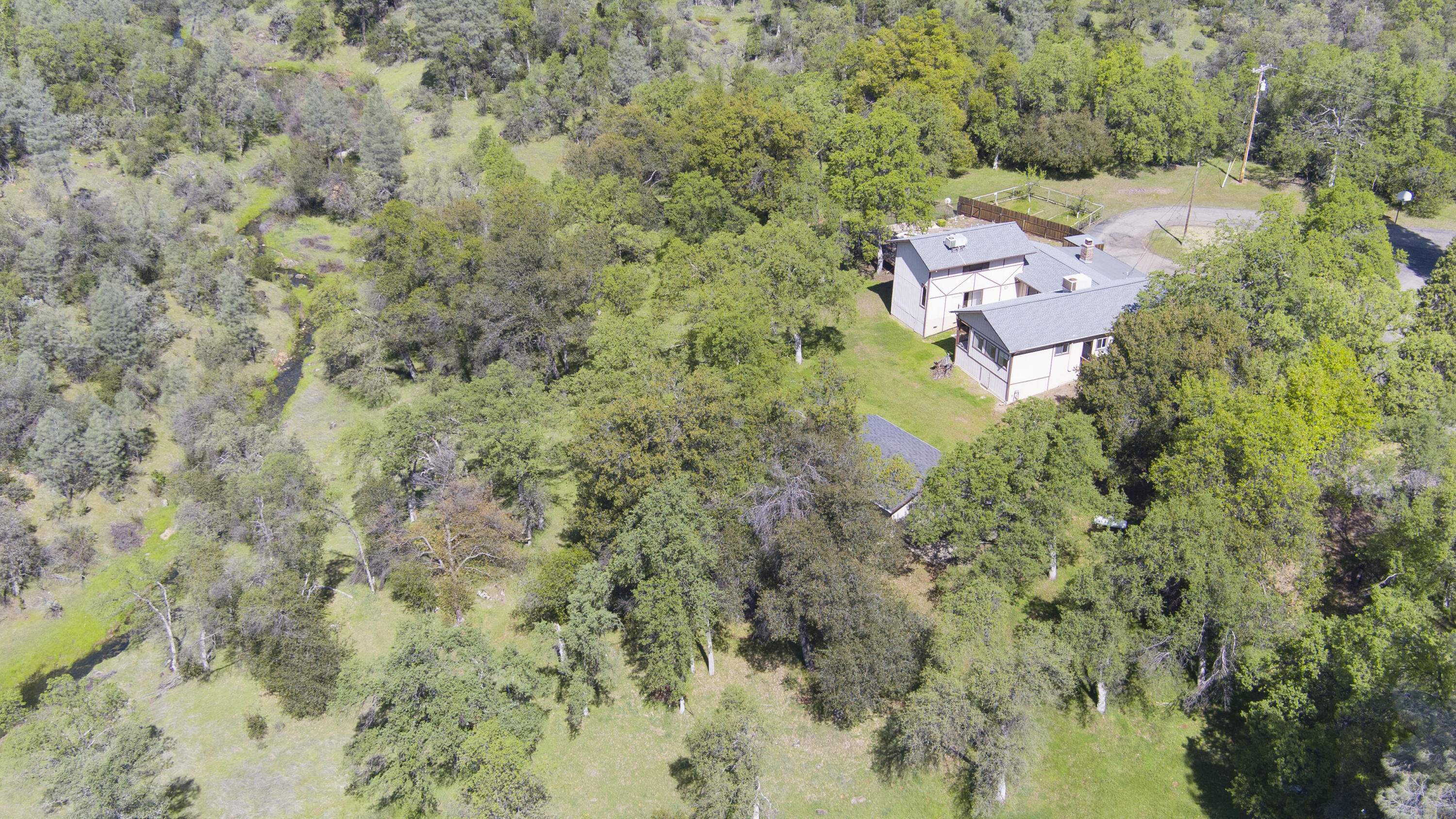 16588 Stanislaus Drive Redding, CA 96001 - Photo 50 of 53 an aerial view of a house with yard and outdoor seating
