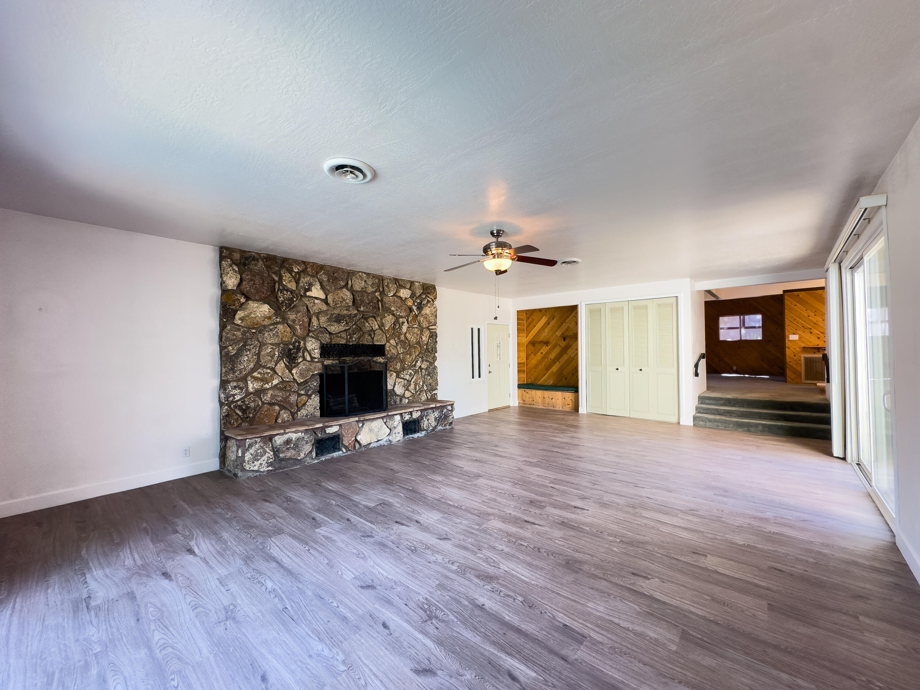 16588 Stanislaus Drive Redding, CA 96001 - Photo 9 of 53 a view of a livingroom with wooden floor and a fireplace