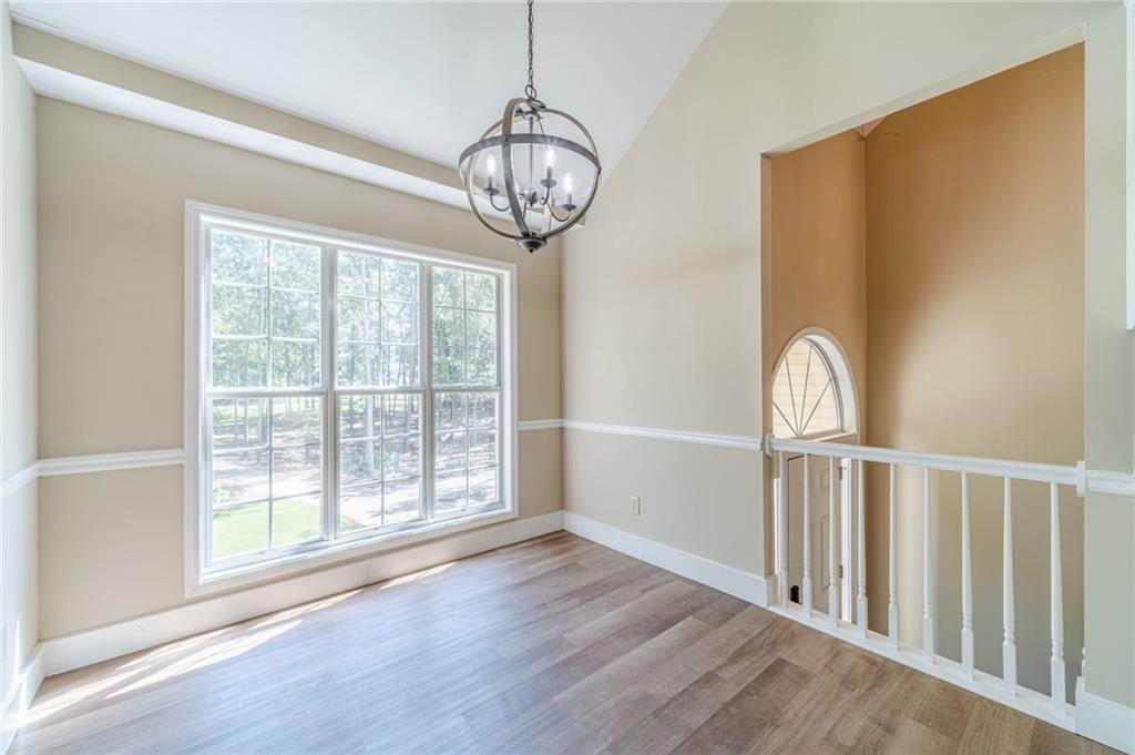 246 Azalea Farms Road Social Circle, GA 30025 - Photo 13 of 27 a view of empty room with wooden floor and fan