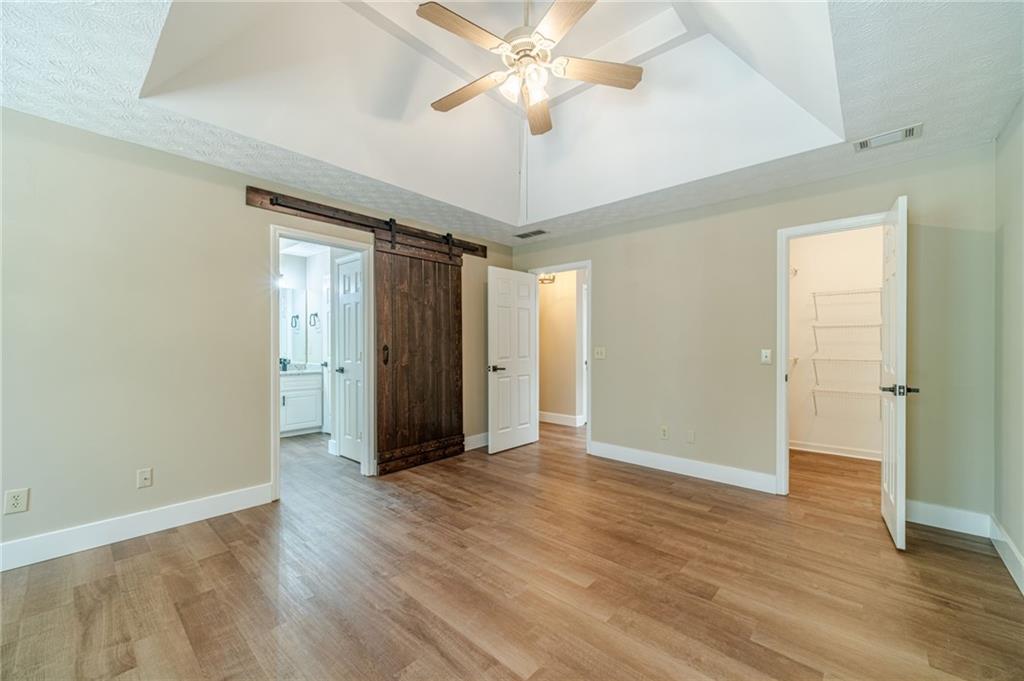 246 Azalea Farms Road Social Circle, GA 30025 - Photo 16 of 27 wooden floor in an empty room with a window