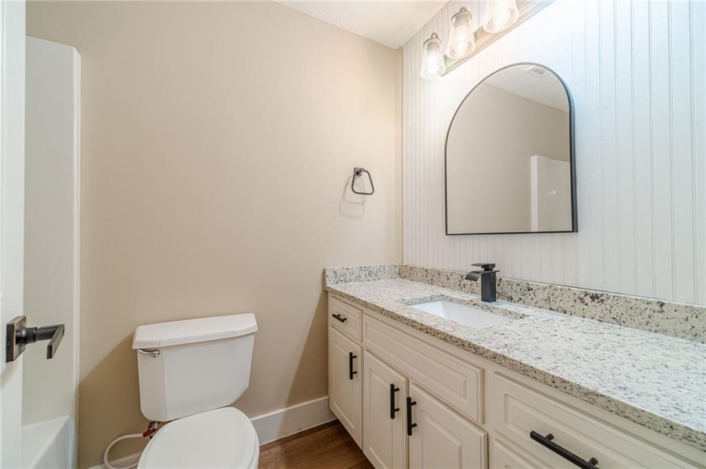 246 Azalea Farms Road Social Circle, GA 30025 - Photo 21 of 27 a bathroom with a toilet sink and mirror