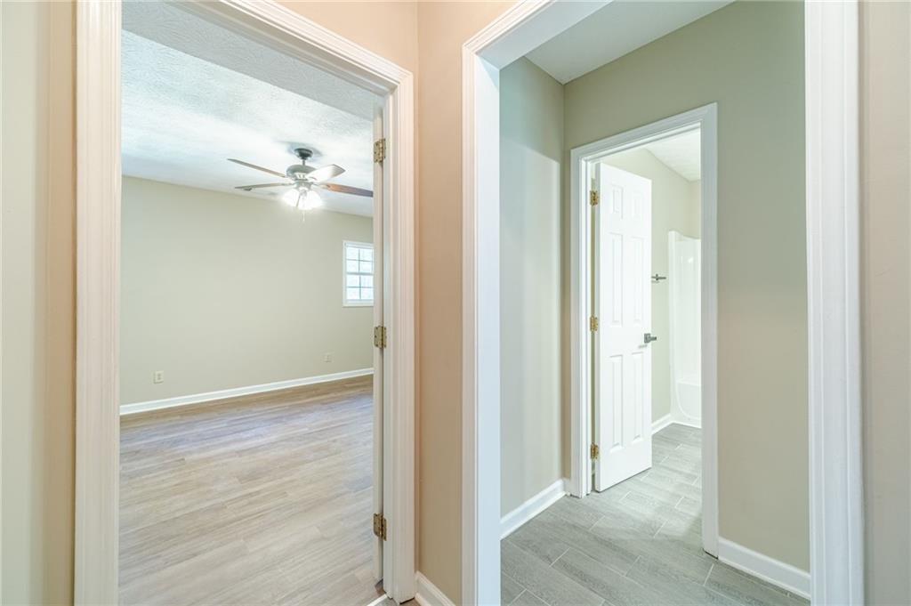 246 Azalea Farms Road Social Circle, GA 30025 - Photo 22 of 27 a view of a hallway with wooden floor
