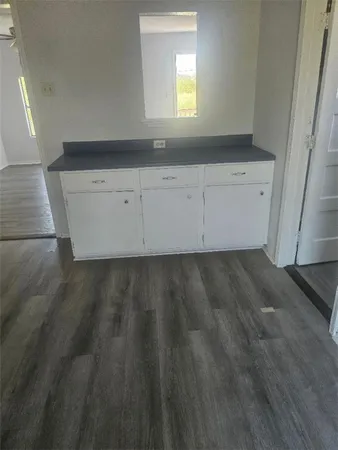 a view of a kitchen sink and cabinets