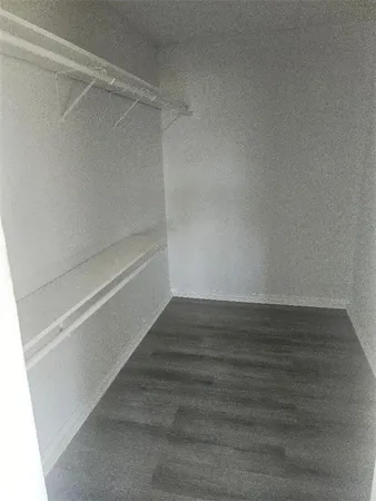a view of an empty walk in closet