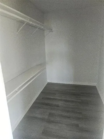 a view of an empty walk in closet