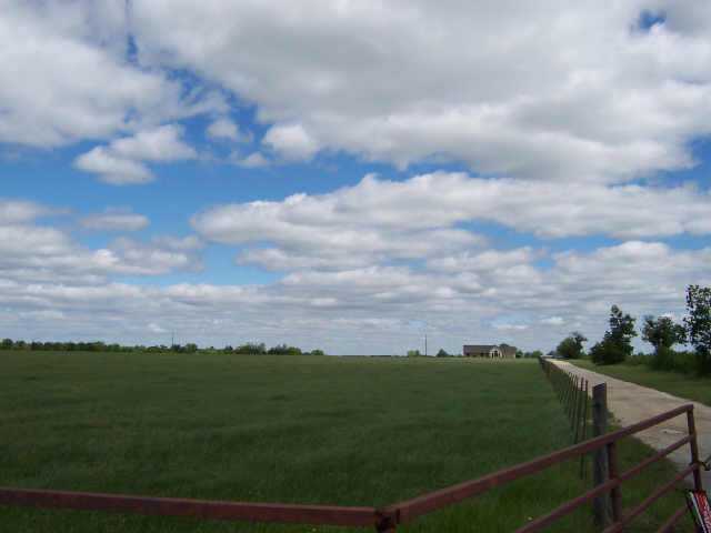 12347 Ballerstedt Road Elgin, TX 78621 - Photo 1 of 1 a view of a city from a balcony