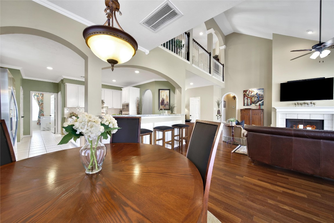 3622 Chessnut Glen Drive Spring, TX 77388 - Photo 11 of 38 a view of a dining room with furniture a chandelier and wooden floor