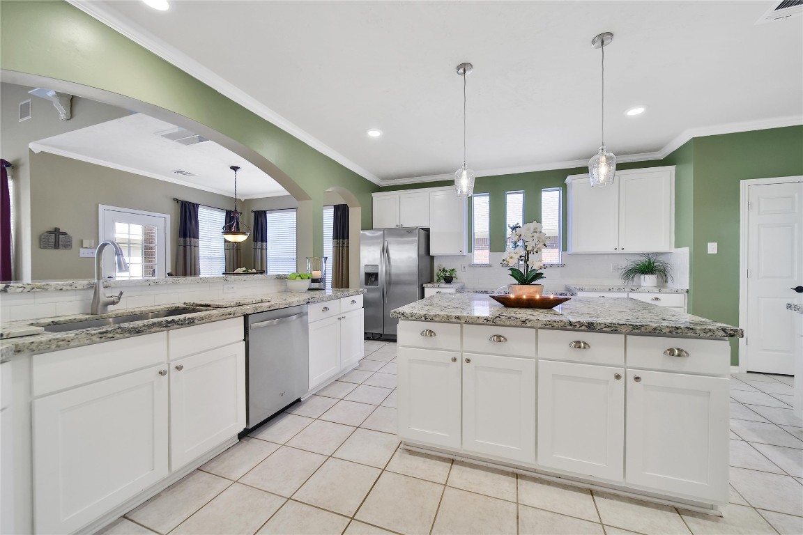 3622 Chessnut Glen Drive Spring, TX 77388 - Photo 14 of 38 a kitchen with white cabinets appliances and a sink