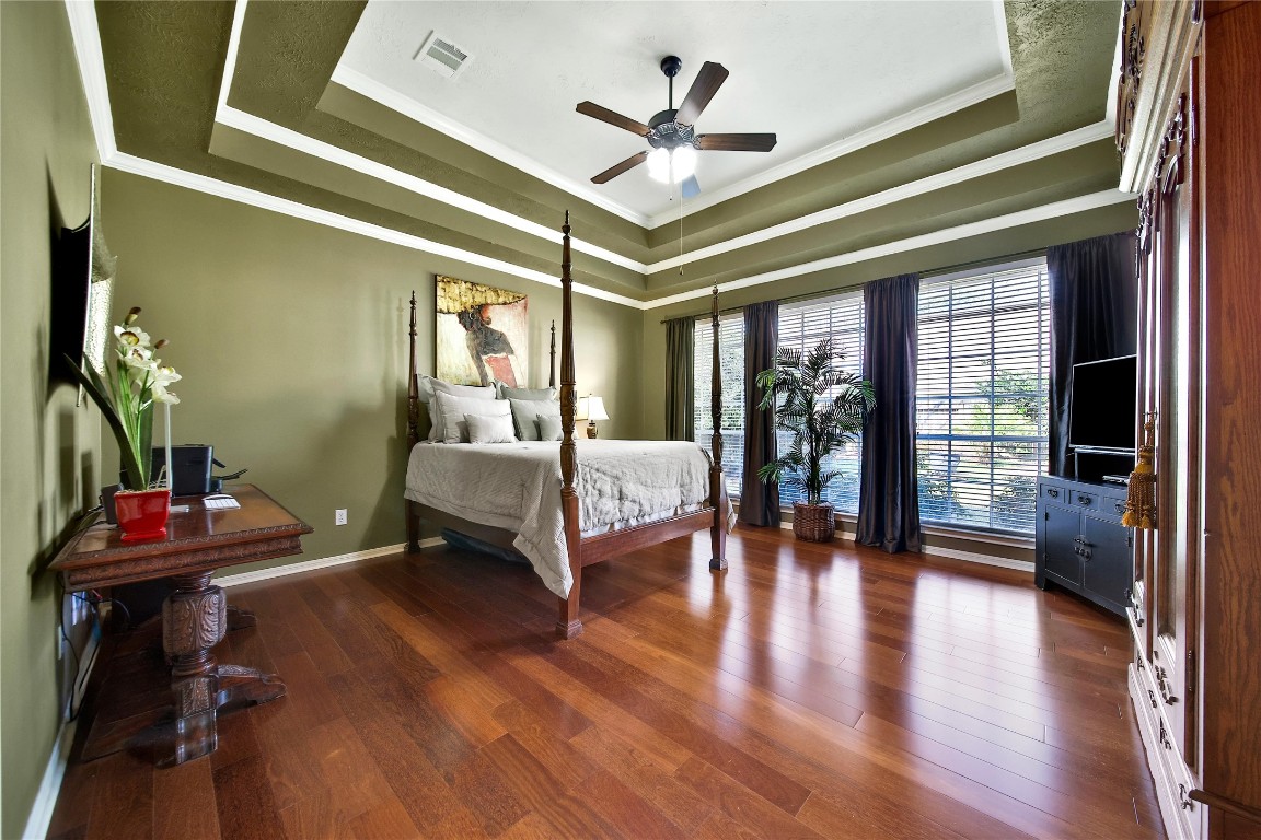 3622 Chessnut Glen Drive Spring, TX 77388 - Photo 18 of 38 a bedroom with furniture wooden floor and a ceiling fan