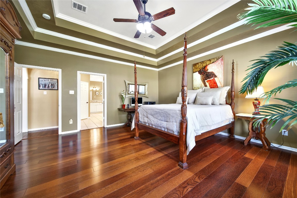 3622 Chessnut Glen Drive Spring, TX 77388 - Photo 19 of 38 a bedroom with a bed and a chandelier