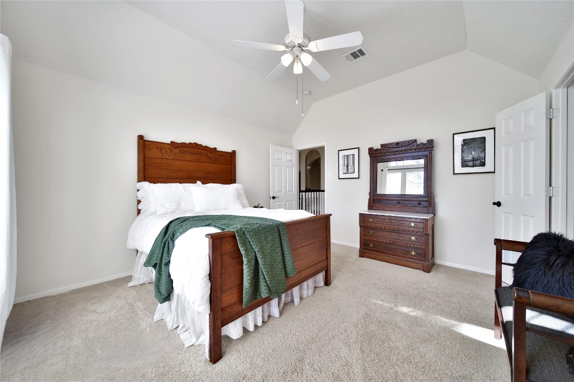 3622 Chessnut Glen Drive Spring, TX 77388 - Photo 25 of 38 a room with a bed and a chandelier