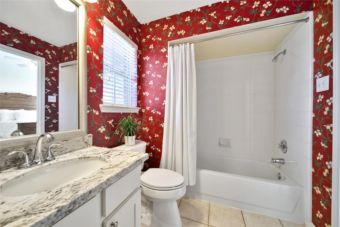 3622 Chessnut Glen Drive Spring, TX 77388 - Photo 26 of 38 a bathroom with a granite countertop sink toilet mirror and bathtub