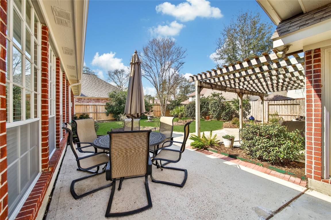 3622 Chessnut Glen Drive Spring, TX 77388 - Photo 33 of 38 a view of a chairs and table in backyard of a house