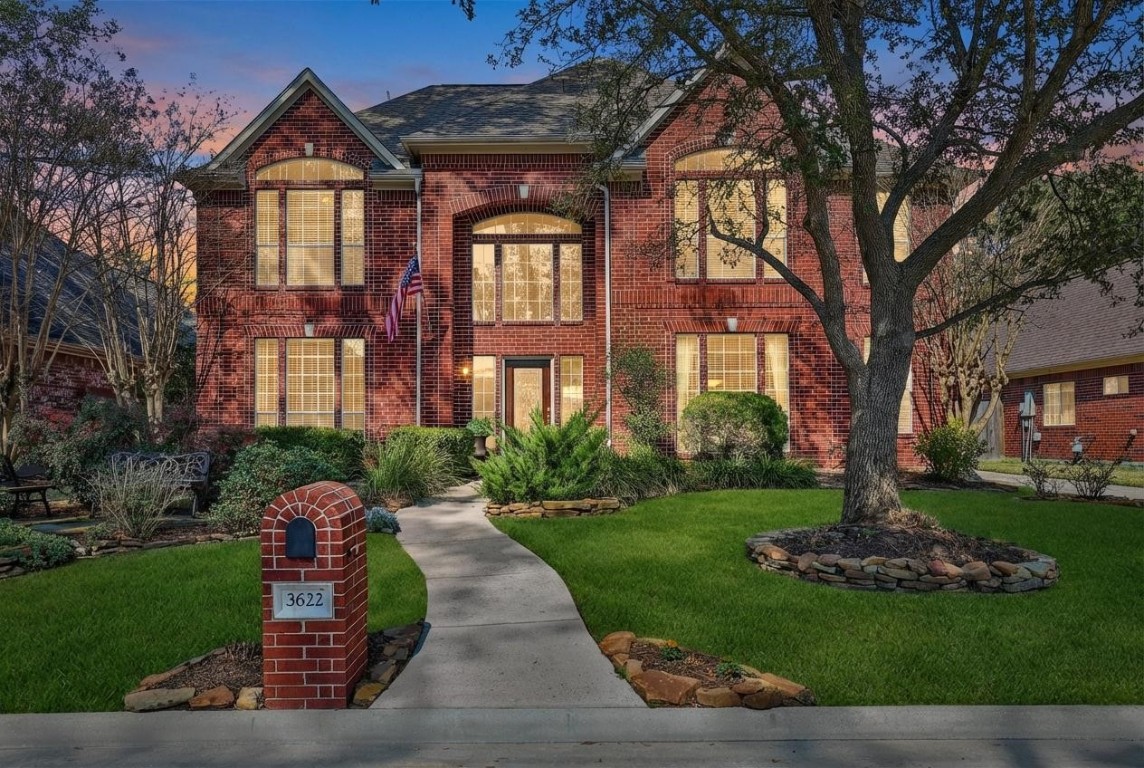 3622 Chessnut Glen Drive Spring, TX 77388 - Photo 36 of 38 a front view of a house with a yard and potted plants