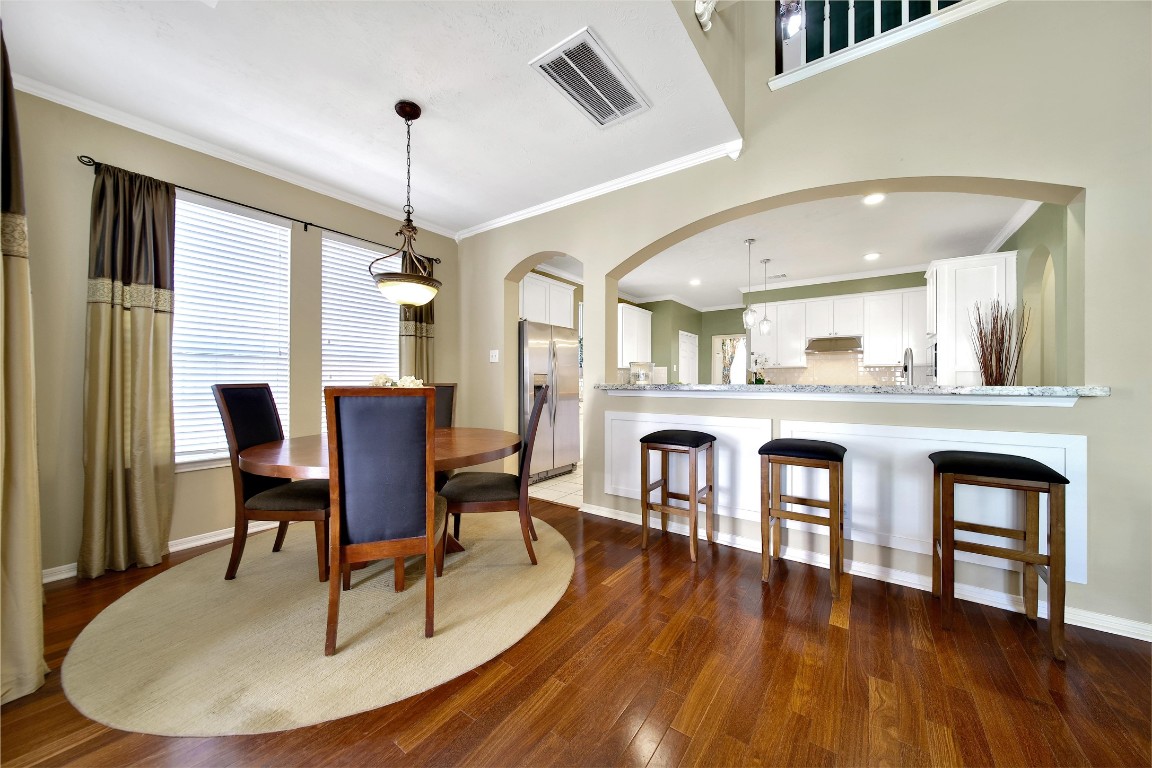 3622 Chessnut Glen Drive Spring, TX 77388 - Photo 10 of 38 a dining room with furniture a chandelier and wooden floor