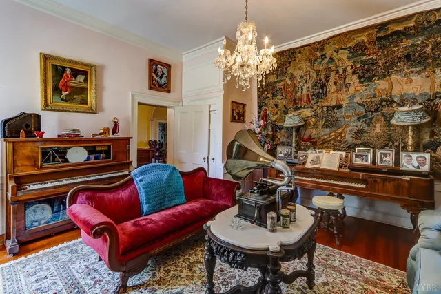 a living room with furniture a large window