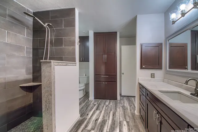 a bathroom with a sink and a mirror