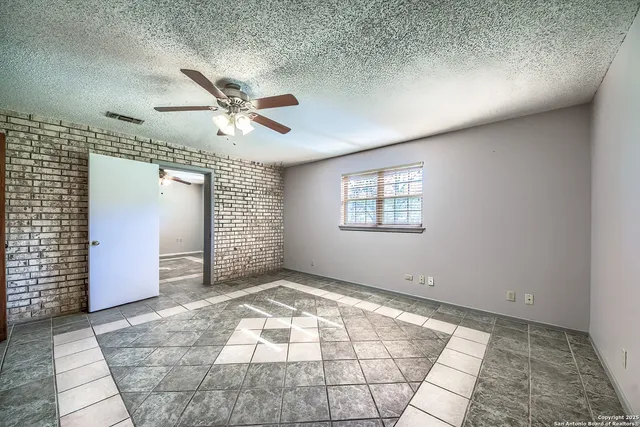 a view of an empty room and window