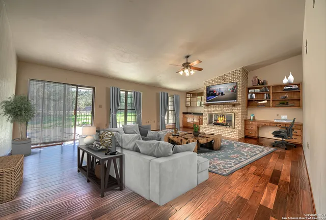 a living room with furniture and a fireplace
