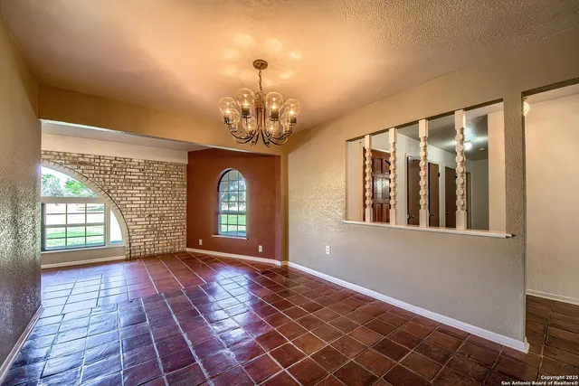 a view of a room with large windows