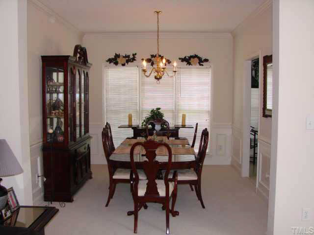 2332 Bolingbrook Lane Raleigh, NC 27613 - Photo 4 of 10 a view of a dining room with furniture window and outside view
