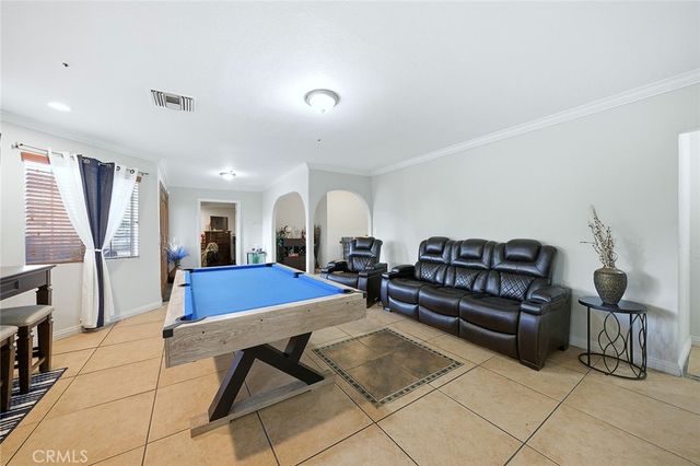 a view of a dining room with furniture and window
