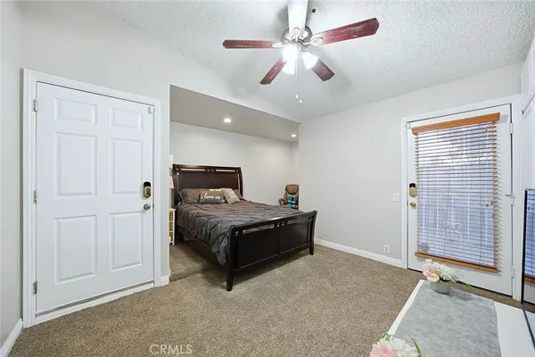a bed room with a bed and a television