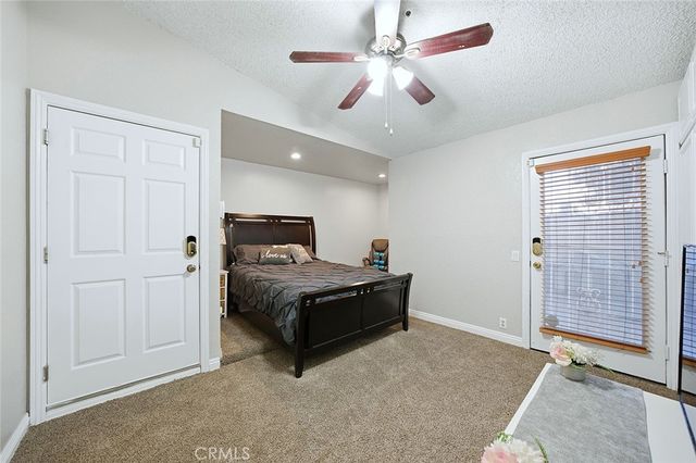 a bed room with a bed and a television