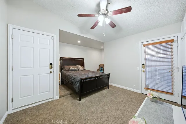 a bed room with a bed and a television