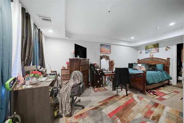 swimming pool view with a seating space