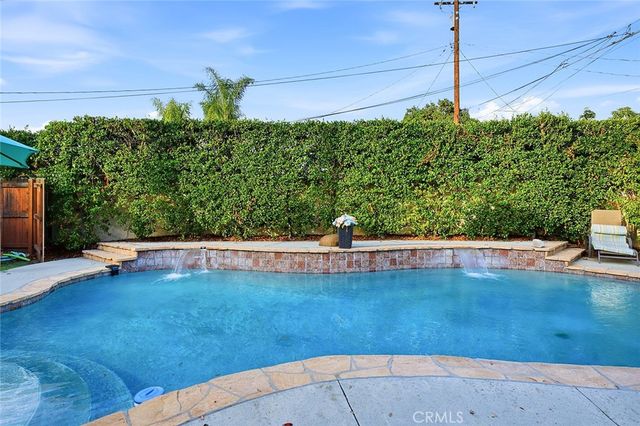 a view of workspace with wooden floor and cabinet