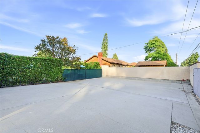 a view of a road with a building in the background