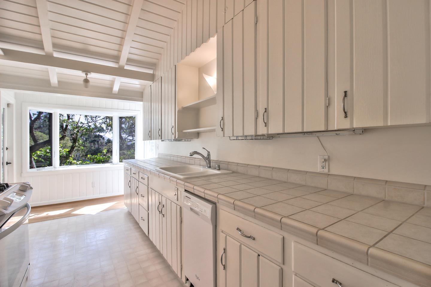 2 San Carlos Street Carmel, CA 93921 - Photo 13 of 22 a kitchen with a sink and cabinets