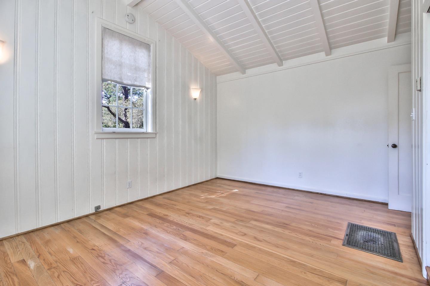 2 San Carlos Street Carmel, CA 93921 - Photo 17 of 22 a view of an empty room with wooden floor