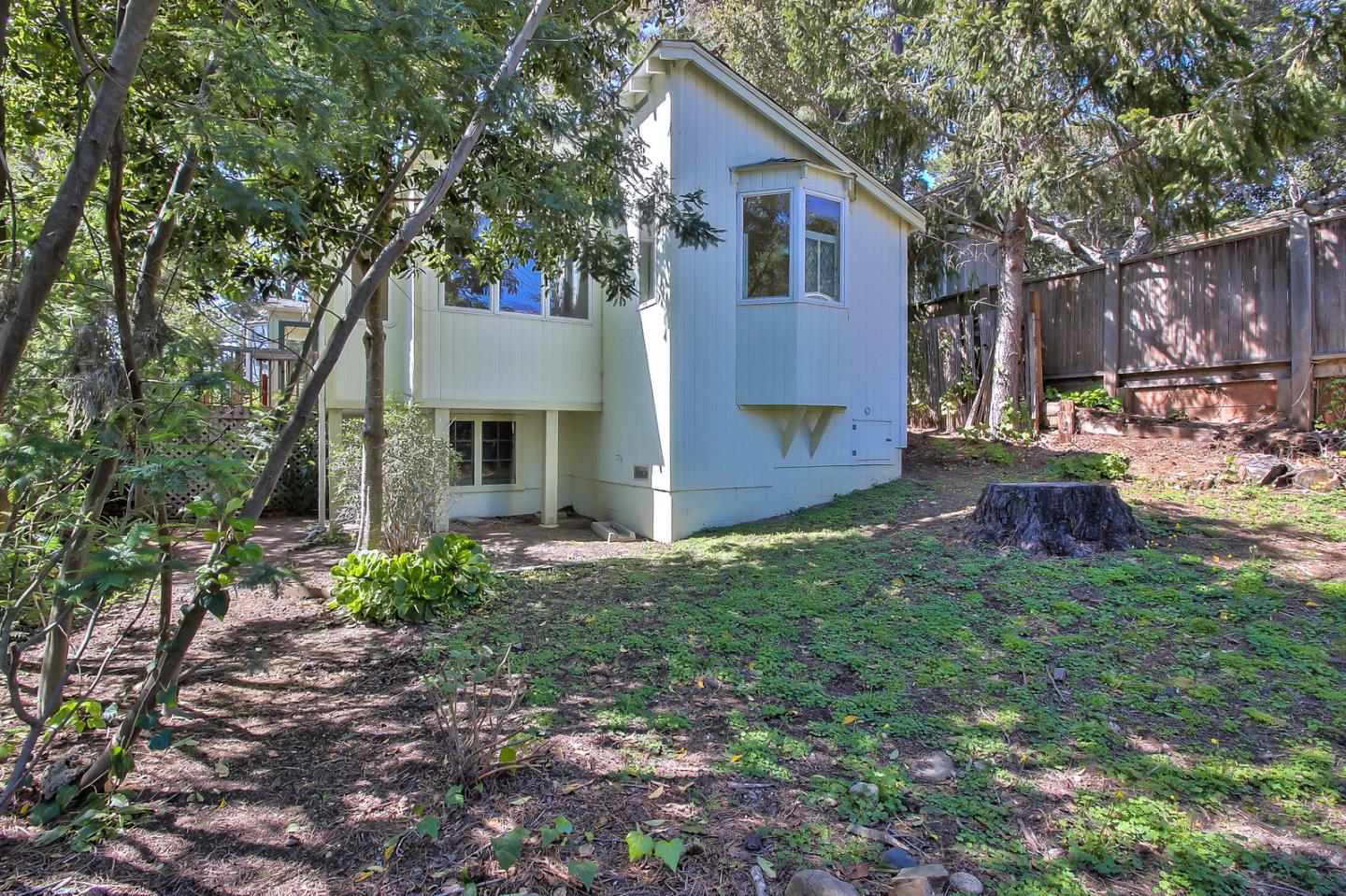 2 San Carlos Street Carmel, CA 93921 - Photo 19 of 22 a view of a house with a yard and sitting area