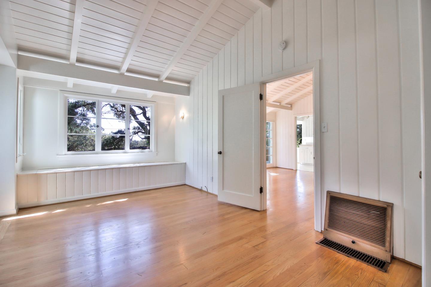 2 San Carlos Street Carmel, CA 93921 - Photo 6 of 22 a view of an empty room with a window and fireplace