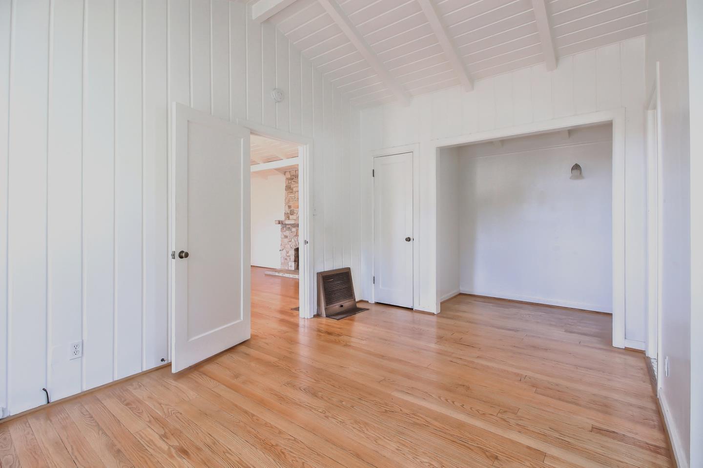 2 San Carlos Street Carmel, CA 93921 - Photo 7 of 22 a view of an empty room with wooden floor