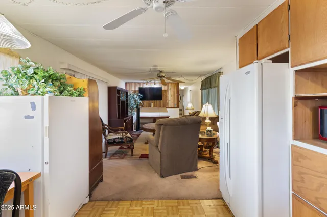 a view of living room with furniture and a window