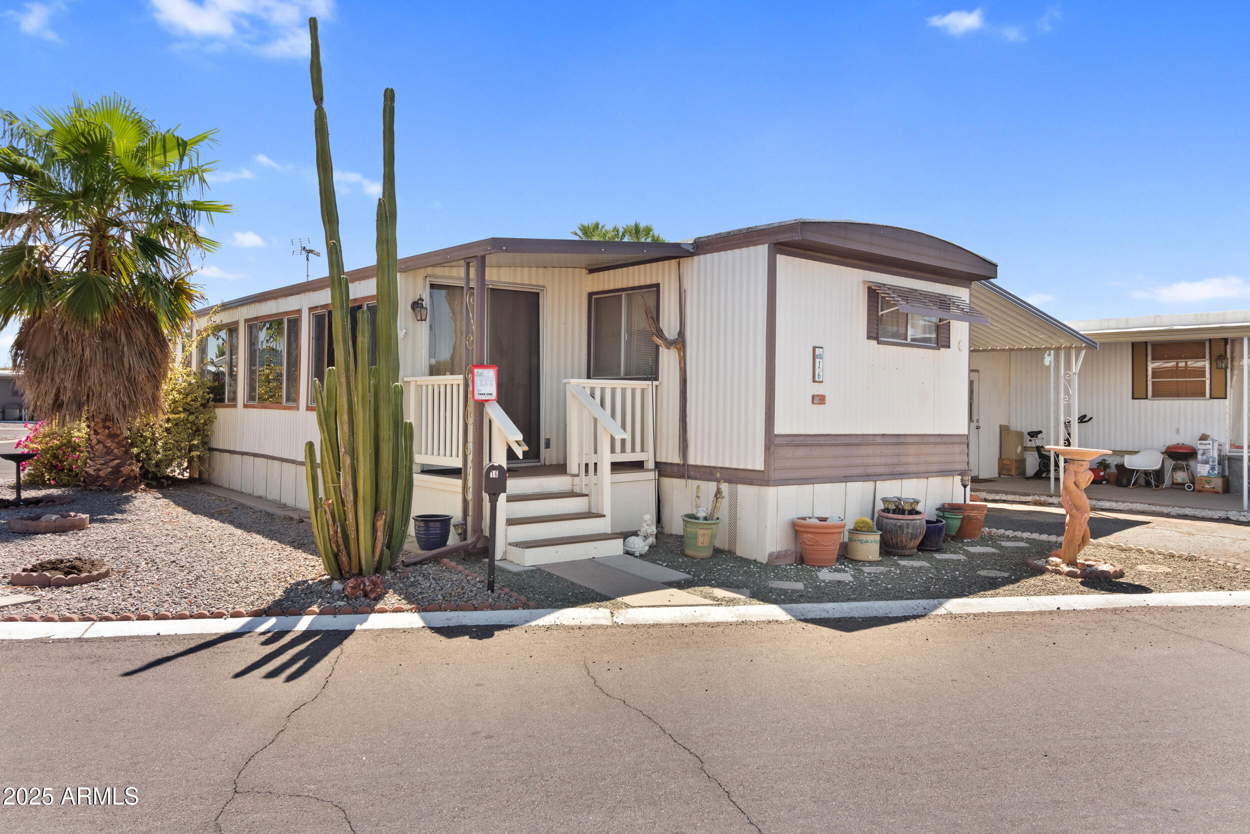 701 South Dobson Road, Unit 16 Mesa, AZ 85202 - Photo 2 of 55 a view of a house with a patio