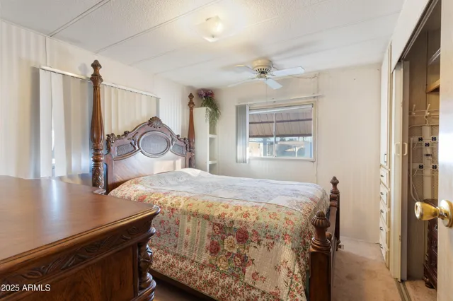 a bedroom with a bed and a table