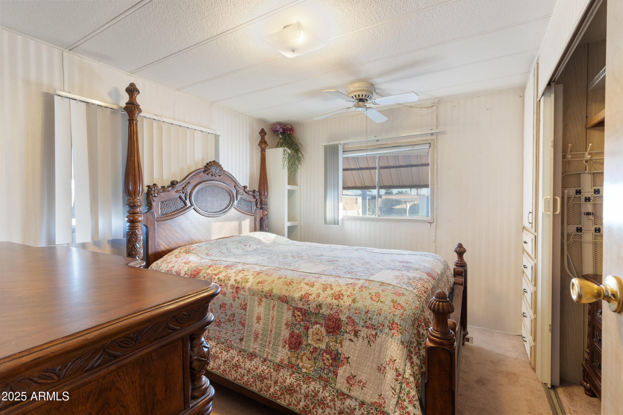 701 South Dobson Road, Unit 16 Mesa, AZ 85202 - Photo 24 of 55 a bedroom with a bed and a table