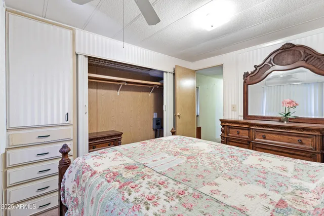 a bedroom with a bed and a dresser