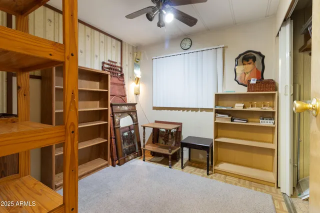 a view of a livingroom with furniture and a window