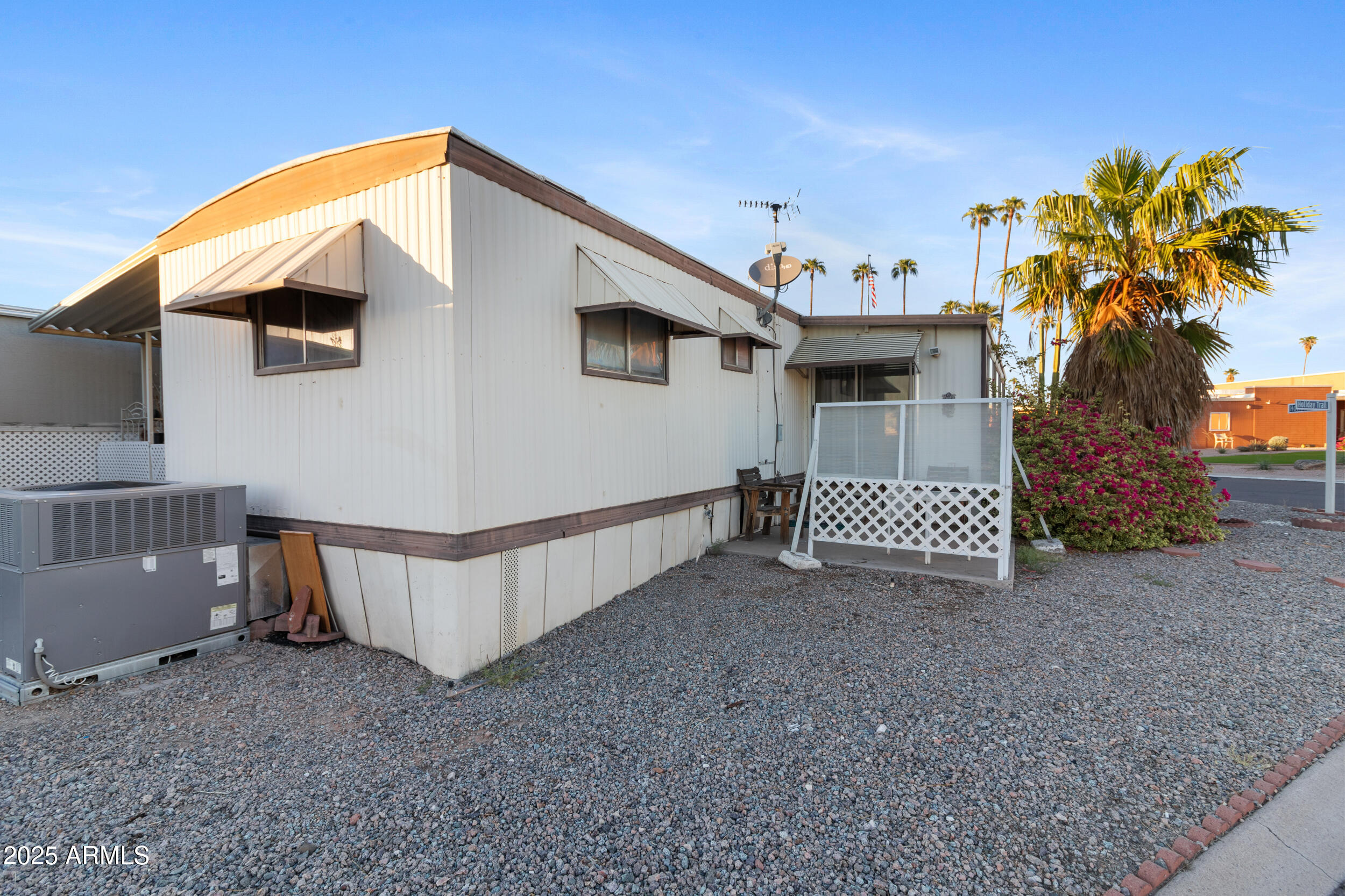 701 South Dobson Road, Unit 16 Mesa, AZ 85202 - Photo 50 of 55 a view of a house with a yard and entertaining space
