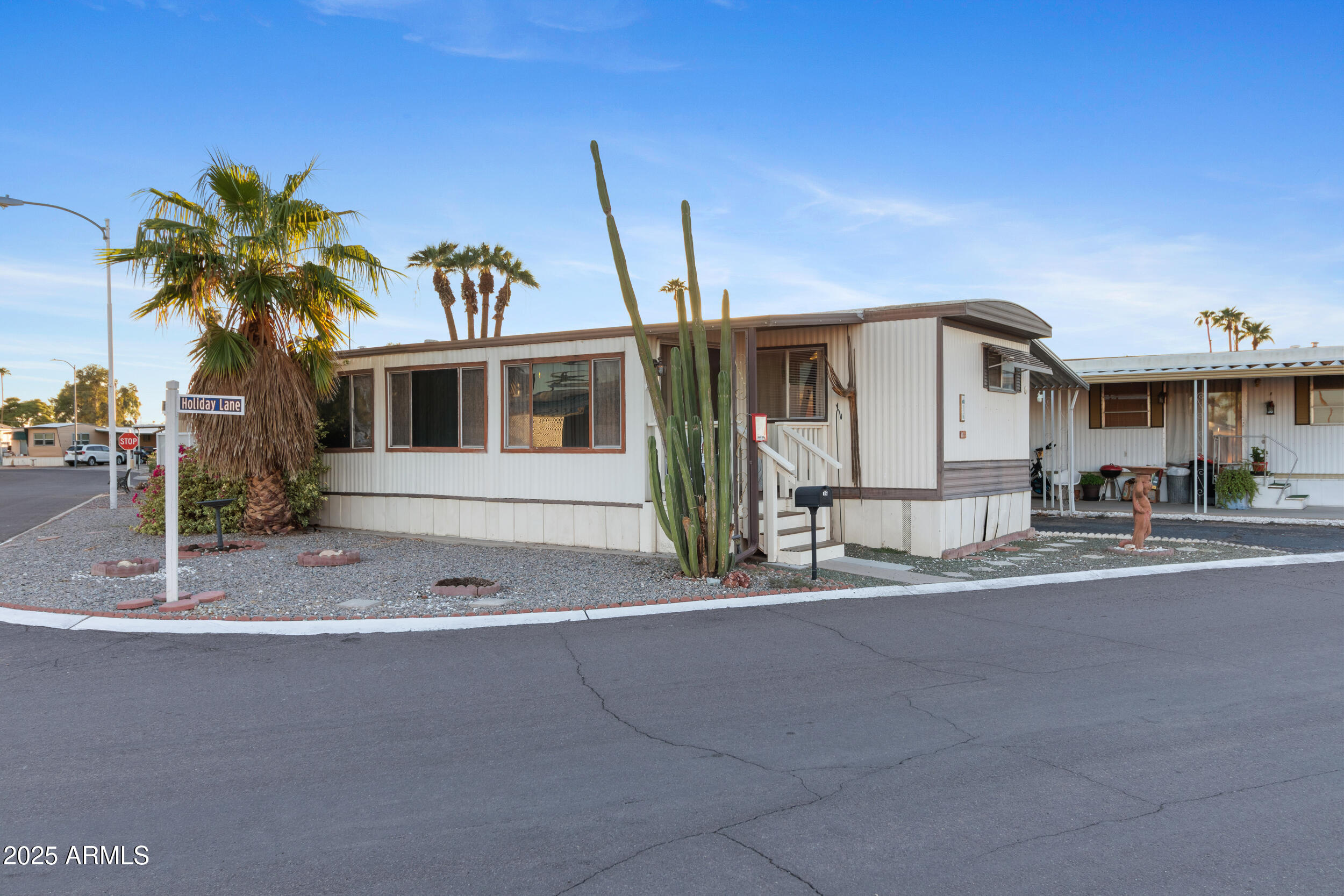 701 South Dobson Road, Unit 16 Mesa, AZ 85202 - Photo 6 of 55 a front view of a house with a yard and garage