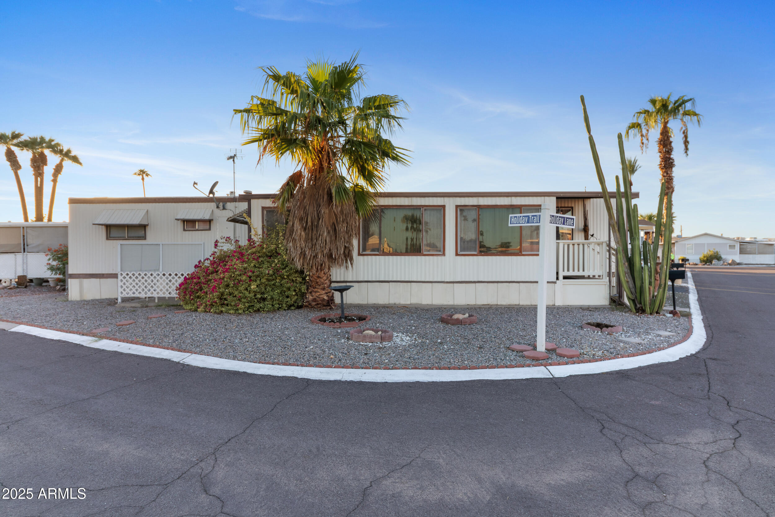 701 South Dobson Road, Unit 16 Mesa, AZ 85202 - Photo 7 of 55 a front view of a house with a garden